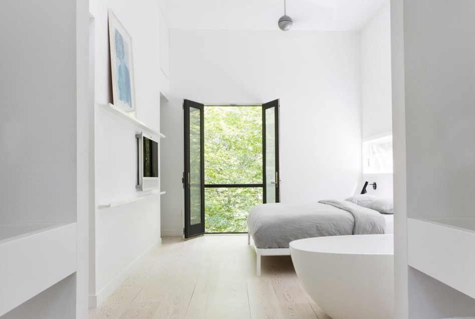 Master bedroom with whitewashed Douglas fir floor and a balcony scandinavian bedroom new york